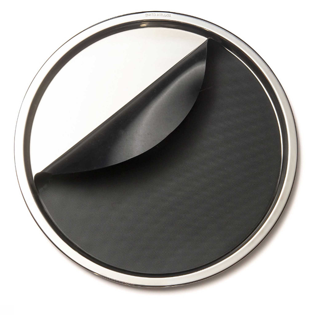 David Mellor stainless steel round tray with mat. SKU 4802310. Making the most of his inherited design expertise in stainless steel, Corin Mellor’s creative mastery is evident in the superb balance, durability, and purity of line of each of the products. 