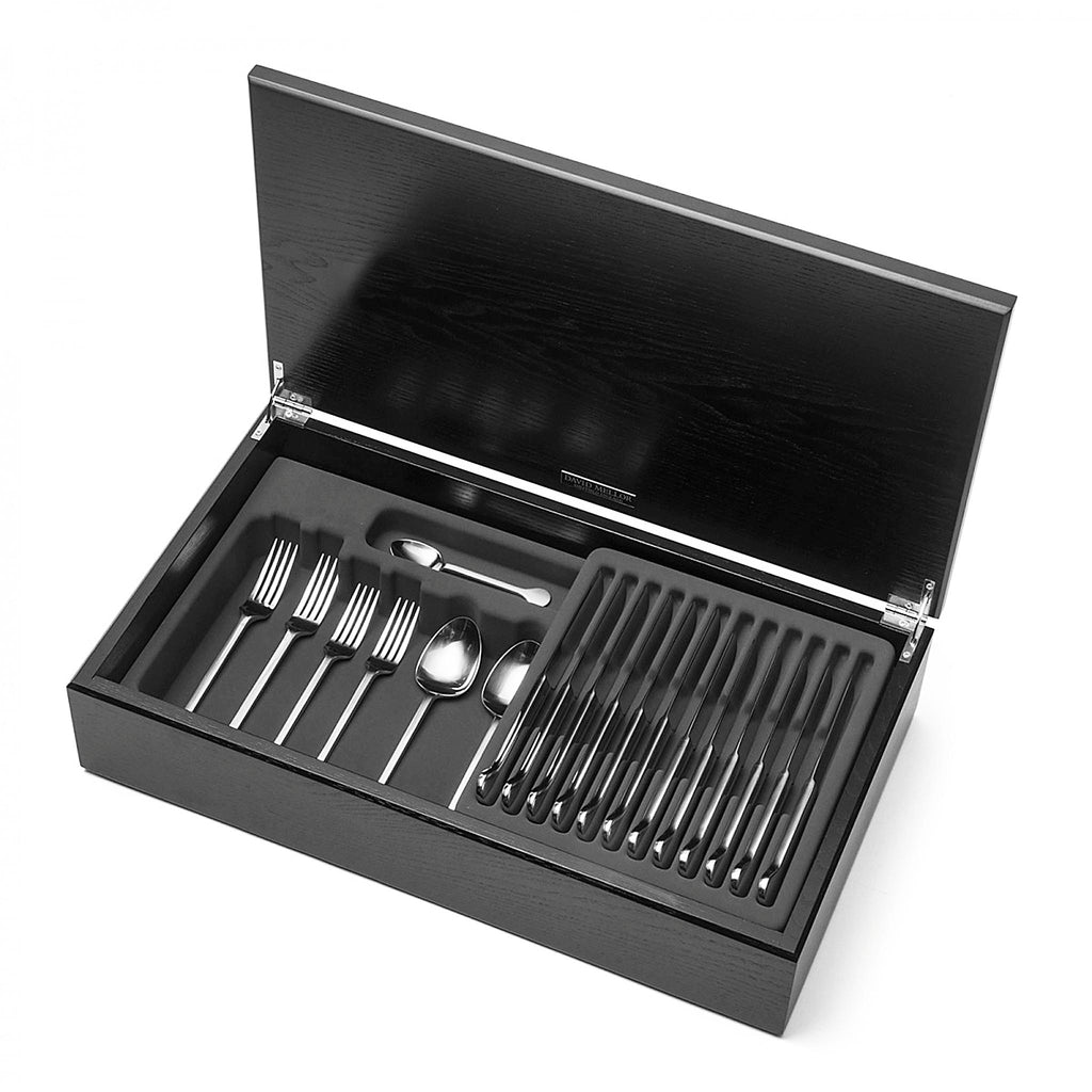 Hoffmann 58-piece cutlery canteen oak. PRODUCT CODE 4991832. Handmade black stained oak canteen box containing:  8 table knives 8 dessert knives 8 table forks 8 dessert forks 8 soup spoons 8 dessert spoons 8 tea spoons 2 serving spoons. Satin finish. 
