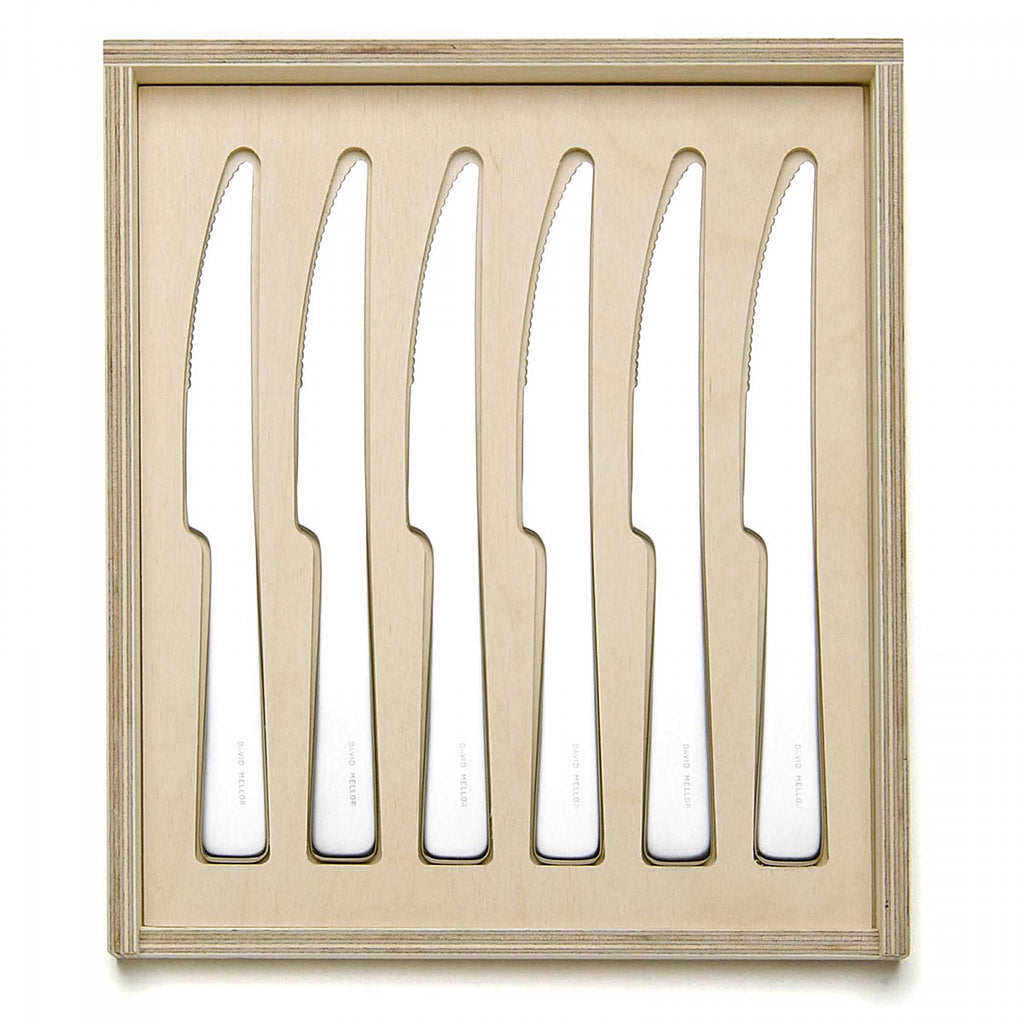 David Mellor London steak knife set. PRODUCT CODE 2518020. Length: 29cm Width: 25cm Depth: 2.5cm Material: Birch plywood, 18/10 stainless steel, martensitic steel. Handmade plywood box with sliding lid.  Contains 6 serrated 'London' knives, each in its individual slot.