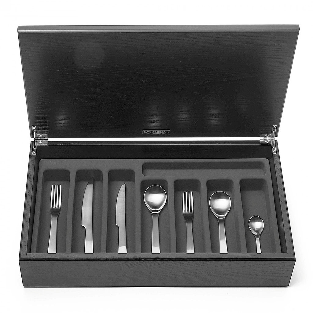 London 44-piece cutlery canteen oak. PRODUCT CODE 4992924. Handmade black stained oak canteen box containing:  6 table knives 6 dessert knives 6 table forks 6 dessert forks 6 soup spoons 6 dessert spoons 6 tea spoons 2 serving spoons. London 58-piece cutlery canteen oak. PRODUCT CODE 4992932. Handmade black stained oak canteen box containing:  8 table knives 8 dessert knives 8 table forks 8 dessert forks 8 soup spoons 8 dessert spoons 8 tea spoons 2 serving spoons.