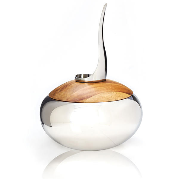 Nambe Scoop Ice Bucket by Wei Young. This ice bucket brings timeless beauty into your home. Perfect for your kitchen tabletop, it is more than just a drinkware accessory. It's a statement piece, exuding elegance and quality that has been recognized globally for over 60 years. With Nambe, you're not just buying an ice bucket, you're investing in a piece of art that graces renowned galleries worldwide.