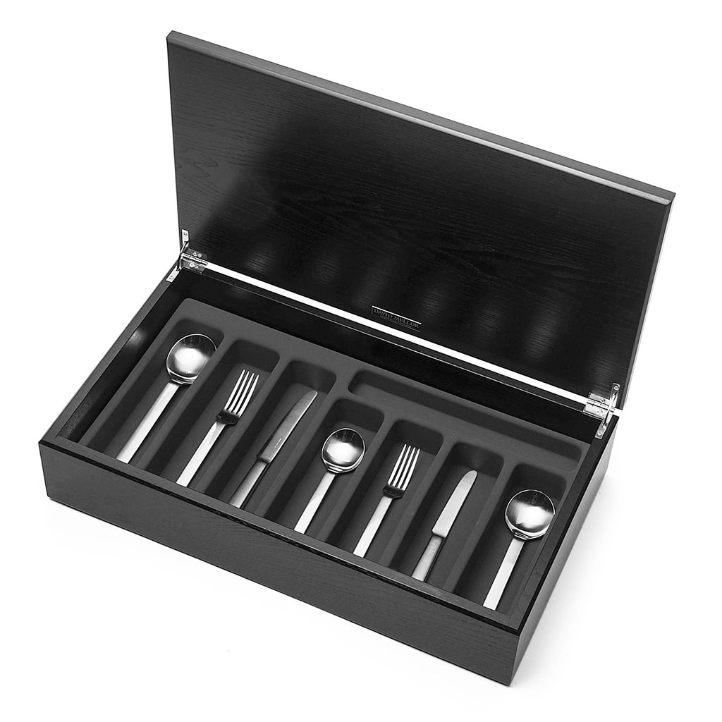 Odeon 58-piece cutlery canteen oak. PRODUCT CODE 4991232. Stainless steel knife handle. Odeon black handled 58-piece cutlery canteen oak. PRODUCT CODE 4993632. Black acetal resin handle. Handmade black stained oak canteen box containing:  8 table knives 8 dessert knives 8 table forks 8 dessert forks 8 soup spoons 8 dessert spoons 8 tea spoons 2 serving spoons.