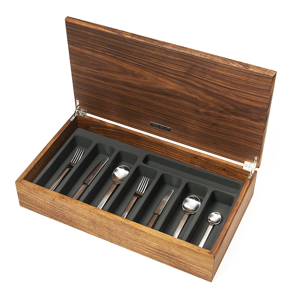 PRODUCT CODE 4991257. Odeon 58-piece cutlery canteen walnut. Stainless steel handle. PRODUCT CODE 4993657. Odeon black handled 58-piece cutlery canteen walnut. Black acetal resin handle. Handmade walnut canteen box containing:  8 table knives 8 dessert knives 8 table forks 8 dessert forks 8 soup spoons 8 dessert spoons 8 tea spoons 2 serving spoons.