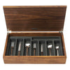 Odeon 44-piece cutlery canteen walnut. Stainless steel handle.  PRODUCT CODE 4991241. Odeon black handled 44-piece cutlery canteen walnut. PRODUCT CODE 4993649. Black acetal resin handle. Handmade walnut canteen box containing:  6 table knives 6 dessert knives 6 table forks 6 dessert forks 6 soup spoons 6 dessert spoons 6 tea spoons 2 serving spoons.