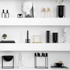 With its 6 mm lacquered steel frame, the black Kubus is what most people think of as the quintessential by Lassen design object. When Søren Lassen began producing his grandfather’s, Mogens Lassen, candleholders in 1994, he chose this classic fine, matte  surface texture to make the graphic, austere lines stand out. Since the candleholder was first made by local artisans in Denmark the collection has extended and every single item in the series now comes in black - because black is always in vogue.