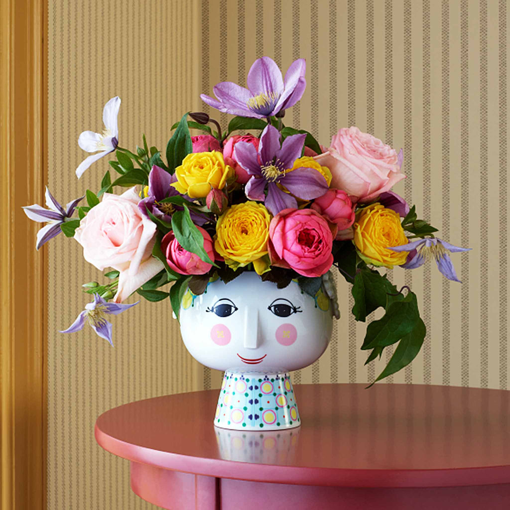 Bjørn Wiinblad’s famous flowerpot is interpreted here as Eva, beautifully decorated on a base. Its delicate neck and the lovely motif of a woman’s face brings a touch of retro-coolness to your home. You can use the plant pot holder on base for anything from herbs to heather, white Christmas roses or trendy cacti to accentuate the 1970s nostalgia – which is super-popular in contemporary home interiors.