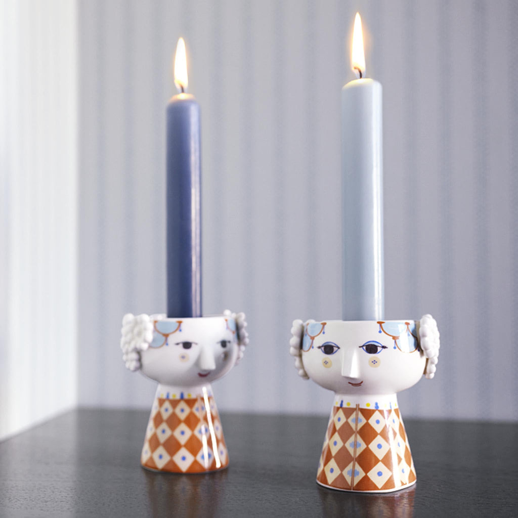 Bjørn Wiinblad Eva Candle Holder, Terracotta 54045. Series: Eva Color: Terracotta Material: Porcelain Height: 3.7" Diameter: 3.1" Note: Dishwasher safe.