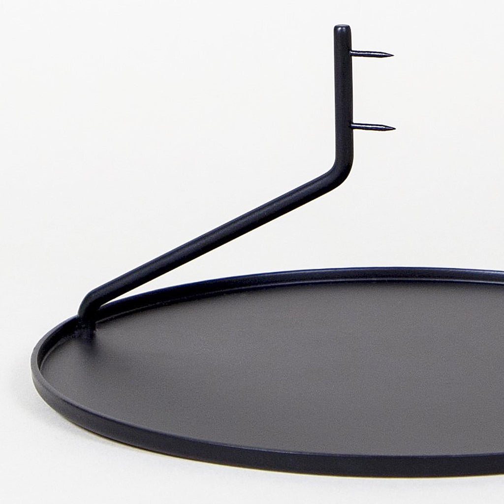 Simple, elegant, and mysterious, the Buka Candlestick uses two pins to suspend a candle above a metal dish - giving it the appearance that it's levitating. Minimal, yet visually effortless, this candleholder is exactly what you need to create a warm, weightless mood. 