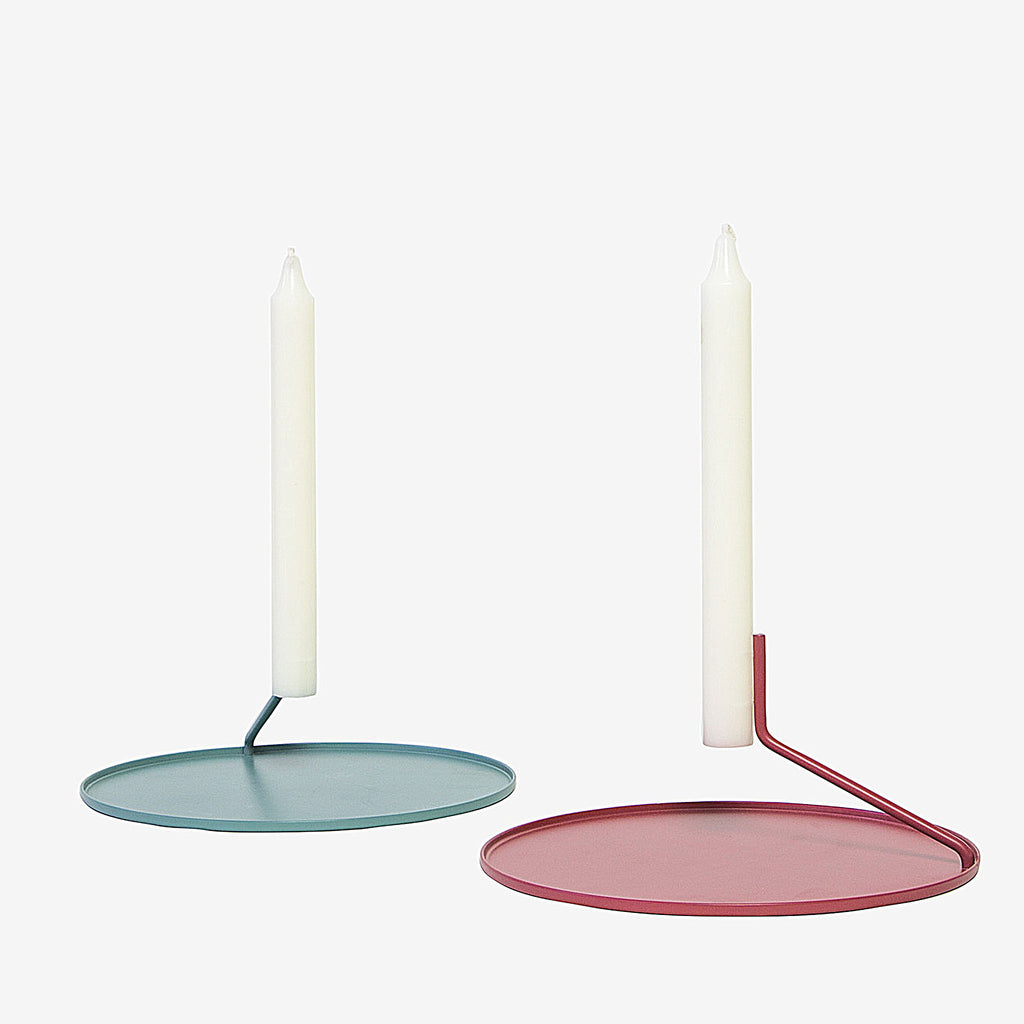 Simple, elegant, and mysterious, the Buka Candlestick uses two pins to suspend a candle above a metal dish - giving it the appearance that it's levitating. Minimal, yet visually effortless, this candleholder is exactly what you need to create a warm, weightless mood. 