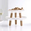 ASA Selection Tappo is a multifunctional centerpiece for the table. The little feet protected by precious cork stand in appealing contrast to the high-gloss surface of the white ceramic plate. Perfectly designed etagere with cork feet.